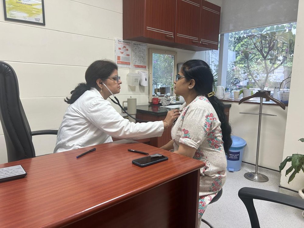 Dr. Seema Dhir consulting with a patient