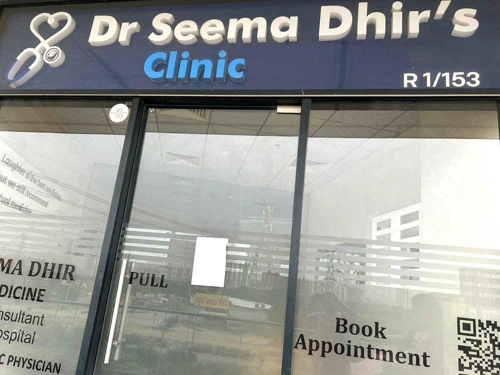 Entrance to Dr Seema Dhir's Clinic, R-1/153, Sector 74, Gurugram, with appointment QR code